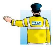 Garda signal: stop, traffic from behind